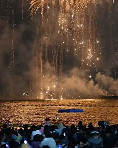 Golden fireworks over the sea
