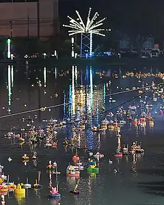 Krathongs floating on the water at night