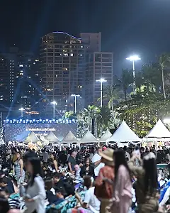 Open-air concert on the beach at night